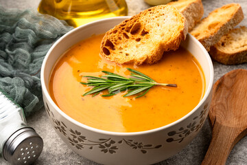 Delicious lentil, ezogelin or pumpkin soup on stone  background