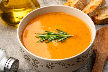 Delicious lentil, ezogelin or pumpkin soup on stone  background