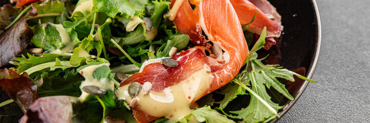 Salad food jamon meat green leaf lettuce appetizer natural fresh gourmet food background on the table rustic food top view copy space keto and paleo diet