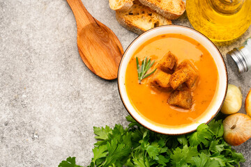 Delicious lentil, ezogelin or pumpkin soup on stone  background