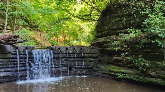 Waterfall through a deep canyon at Matthiessen State Park in central Illinois