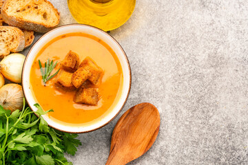 Delicious lentil, ezogelin or pumpkin soup on stone  background