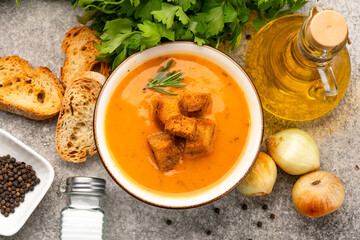 Delicious lentil, ezogelin or pumpkin soup on stone  background