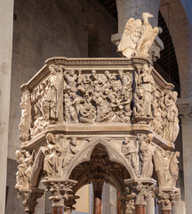 PISTOIA, ITALY - MARCH 16, 2025: The marble medieval pulpit with the relief of Massacre of Inocents...