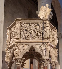  PISTOIA, ITALY - MARCH 16, 2025: The marble medieval pulpit with the relief of Massacre of Inocents on the in the church Pieve di Sant'Andrea by Giovanni Pisano from year 1301. © Renáta Sedmáková