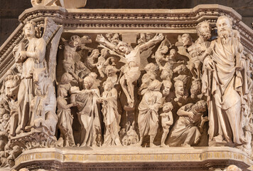 PISTOIA, ITALY - MARCH 16, 2025: The marble relief of Crucifixion on the medieval pulpit in the...