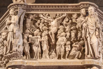  PISTOIA, ITALY - MARCH 16, 2025: The marble relief of Crucifixion on the medieval pulpit in the church Pieve di Sant'Andrea by Giovanni Pisano from year 1301. © Renáta Sedmáková
