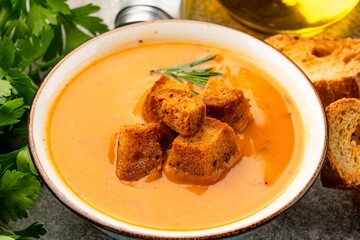 Delicious lentil, ezogelin or pumpkin soup on stone  background