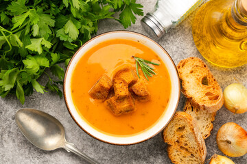 Delicious lentil, ezogelin or pumpkin soup on stone  background