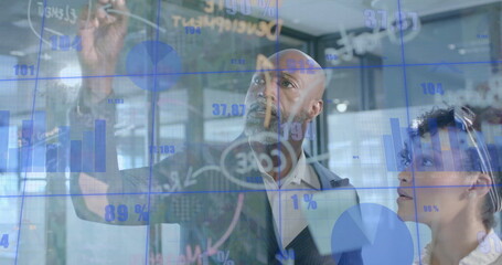 Image of financial data processing over diverse business people in office