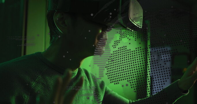 Image of data processing and globe over asian male it technician wearing vr headset