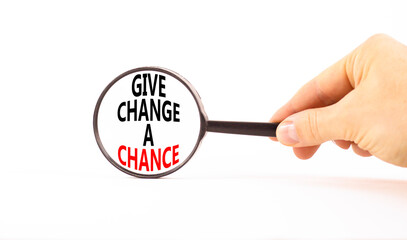 Give change a chance symbol. Concept words phrase Give change a chance in beautiful magnifying...