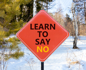 Learn to say no symbol. Concept words phrase Learn to say no on beautiful red road sign. Beautiful...