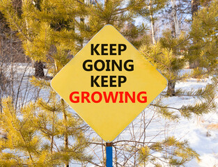 Keep going and growing symbol. Concept words phrase Keep going keep growing on beautiful yellow...