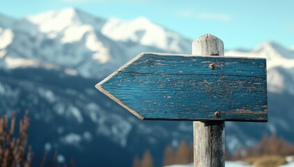Blank Wooden Signpost with Snowy Mountains.
