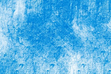 Obraz premium Light blue textured background with grunge effect. The texture looks rough and uneven. There are different shades of color that make it look old or worn.