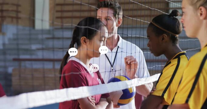 Coach holding whistle guiding players with volleyball at net in training, showing animated stats