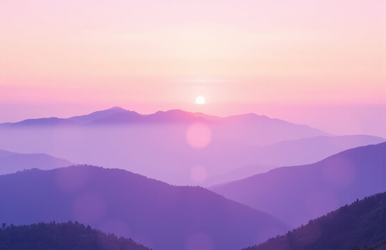 Rolling pastel mountains at sunrise with mist and soft lighting.