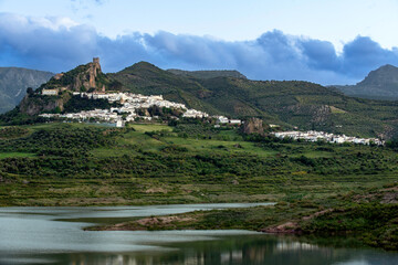 Zahara de la Sierra on a cloudy day with lake view