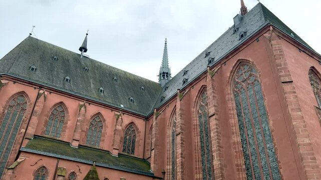 Majestic w&uuml;rzburg cathedral showing architectural details under cloudy sky