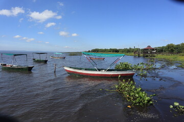 Small fishing boats along the shoreline of Lake Ypacaraí near Areguá, Paraguay