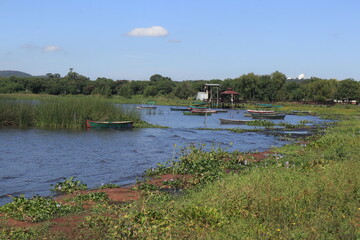 Small fishing boats along the shoreline of Lake Ypacaraí near Areguá, Paraguay