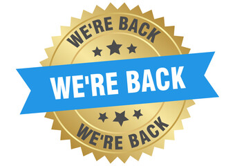 we're back. we're back round blue and gold label isolated on transparent background