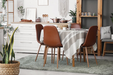 Table and counter with dishes in interior of dining room