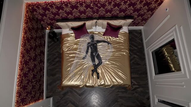 Black mannequin lying on gold silk sheets in a luxurious bedroom with damask wallpaper, seen from above, creating an opulent and artistic scene