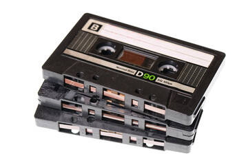 Obraz premium Stack of retro audio cassettes isolated on white background