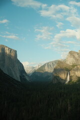 Yosemite National Park in California’s Sierra Nevada mountains green foliage on sunny day beautiful landscape