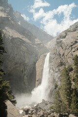 Yosemite National Park in California’s Sierra Nevada mountains aesthetic greenery landscape scenery on sunny day granite cliffs waterfall