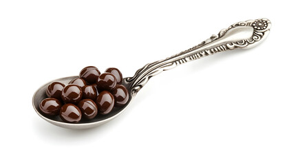 Spoon with cod liver oil pills on white background