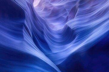 Obraz premium Stunning Antelope Canyon's swirling sandstone walls in shades of deep blue and purple, a natural masterpiece.
