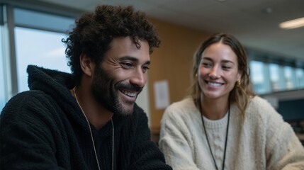 Collaborative Interaction Between a Middle Eastern Man and a White Woman in a Modern Workspace Setting