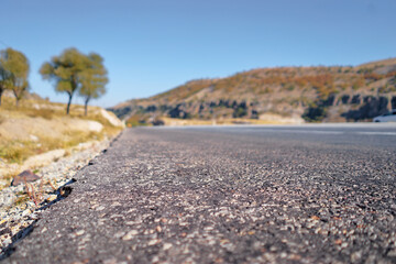 Close-Up View of Asphalt Road in Scenic Countryside Landscape..