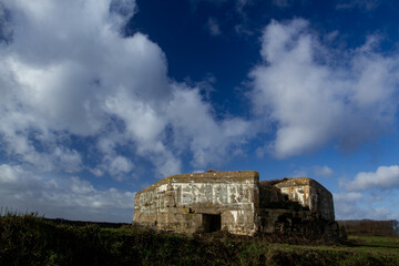 Bunker of World War One in agricultural field, relic of Western Europe battlefield frontline. Past...