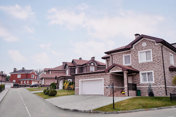 Modern Suburban Brick House in Peaceful Residential Area on Sunny Day..