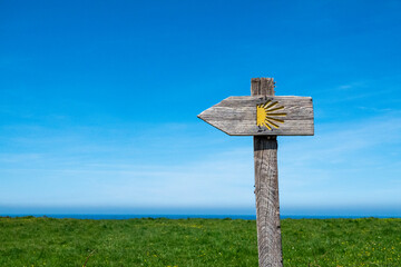 Waymarking with blue sky and Scallop Shells on the Camino de Santiago or the Way of Saint James. Santiago de Compostela pilgrimage.