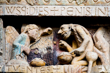 Tympanum of the Last Judgment (12th century). Last Judgment scene between heaven and hell.