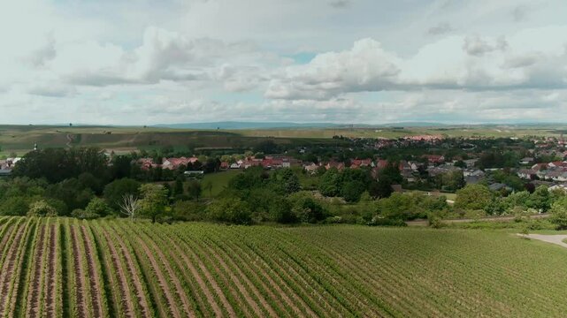 Drone Footage of Tractors Driving and Standing on Farmland &ndash; Aerial View of Agricultural Machinery in Action