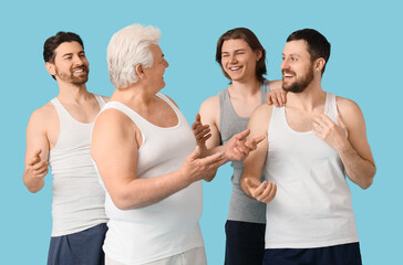 Group of happy men on blue background. Body positive concept