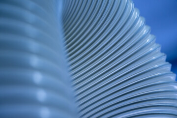Obraz premium Flexible PUR antistatic suction hose for air conditioning, background flexi hose, industrial ventilation. 