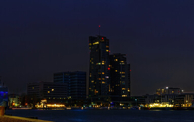 Fototapeta premium Night cityscape in Gdynia. Skyscrapers and pier on the Baltic Sea