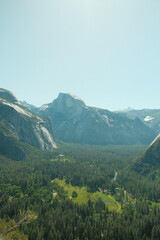 Yosemite National Park in California’s Sierra Nevada mountains aesthetic greenery landscape scenery on sunny day granite cliffs waterfall