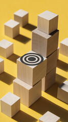 Fototapeta premium Wooden cubes stacked, forming a rising structure, with a target symbol on one cube, showcasing achievement, progress, or goal attainment