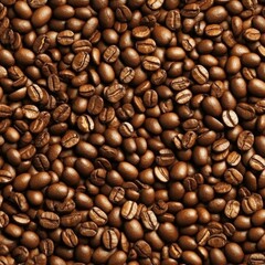 Fototapeta premium Overwhelming close-up of numerous roasted coffee beans densely packed, creating a uniform brown texture and suggesting abundance or a coffee bean harvest