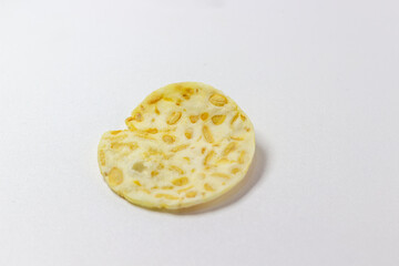 Crispy tempeh chips isolated white background. Indonesian snack. Tempeh crackers. Healthy food. Vegan. Traditional. Delicious.