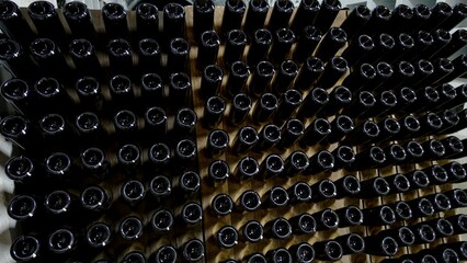 Wine bottles close-up in winery. wine bottles on the wine rack
