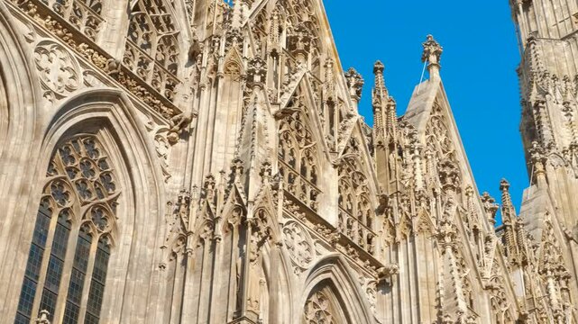 Facade of st. Stephen's cathedral in vienna. Architectural details of st. Stephen's cathedral in vienna, austria, showcasing its intricate gothic design against a vibrant blue sky